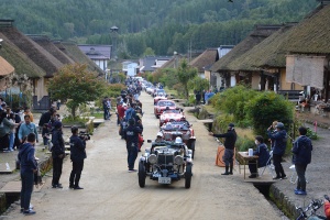 Cars lined up at stamp point Ouchijuku